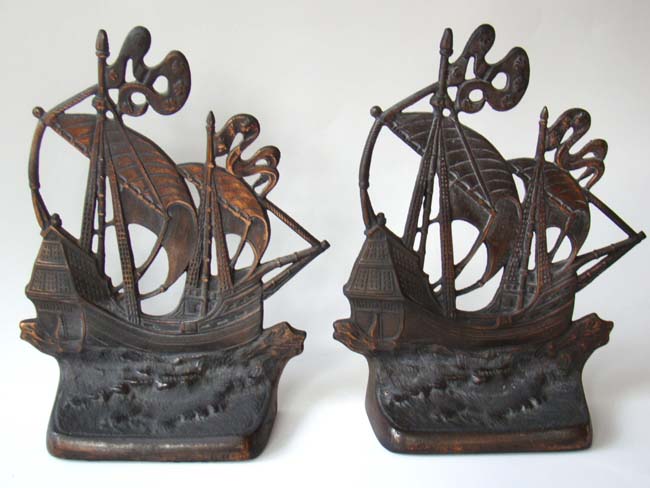 A pair of cast iron bookends depicting a 15th century Galleon made by the Gift House of New York in 1926.